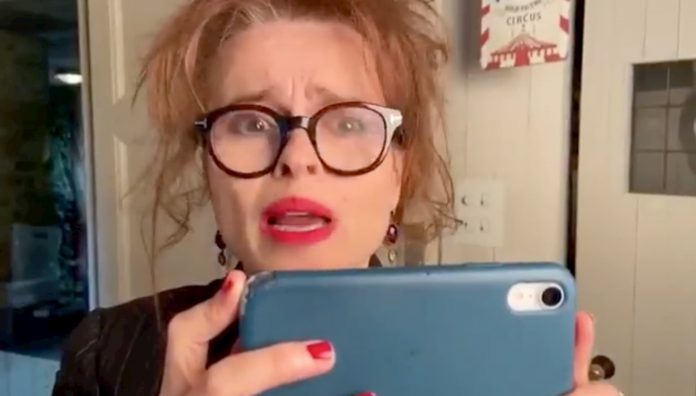 Helena Bonham Carter playing a smartphone