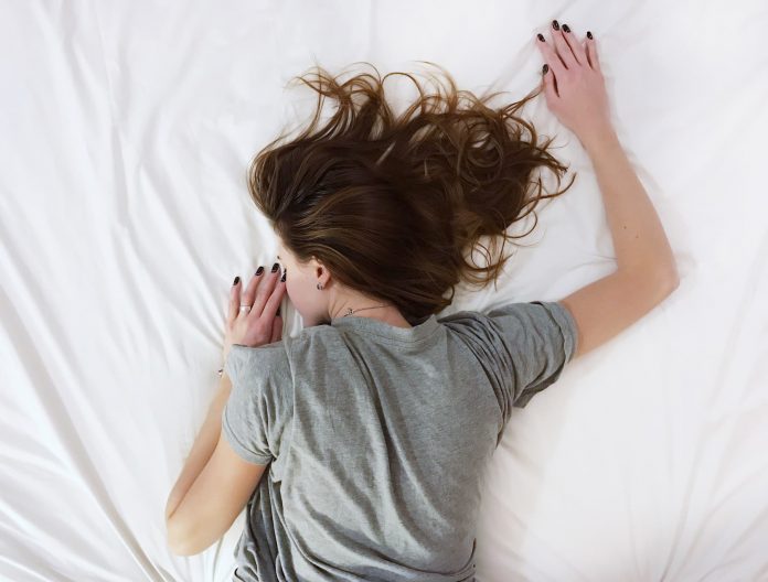 girl sleeping on mattress